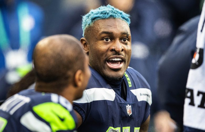 DK Metcalf talks with Tyler Lockett back on the Seahawks bench after Metcalf went for 84-yards on the touchdown in the 1st quarter.
.
The New Orleans Saints played the Seattle Seahawks in Monday Night Football October 25, 2021 at Lumen Field, in Seattle, WA. 218602