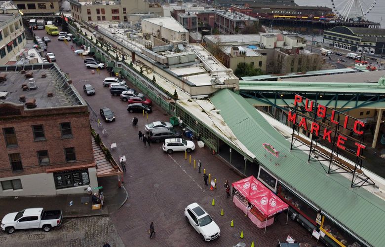 A discussion is taking place on vehicles at Pike Place Market, seen from the air Tuesday, Dec. 7, 2021 in Seattle. 218996