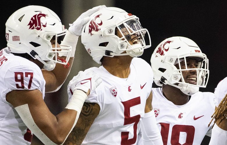 Derrick Langford (5) gets the interception of the Sam Huard pass in the 3rd quarter.
.
The Washington State Cougars played the Washington Huskies in Pac-12 football Friday, Nov 26, 2021, in the annual Apple Cup game from Husky Stadium, in Seattle, WA. 218875