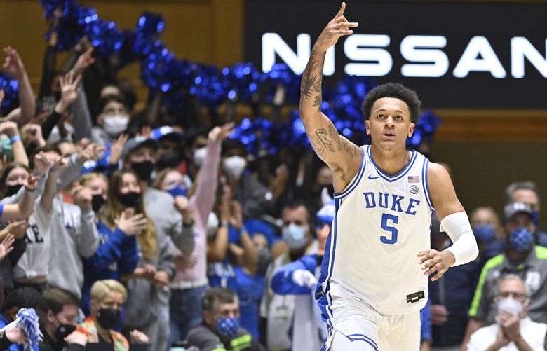 Duke’s Paolo Banchero (5) celebrates after making a 3-point shot against Clemson during the first half at Cameron Indoor Stadium on Tuesday, Jan. 25, 2022, in Durham, North Carolina. (Grant Halverson/Getty Images/TNS) 45804565W 45804565W