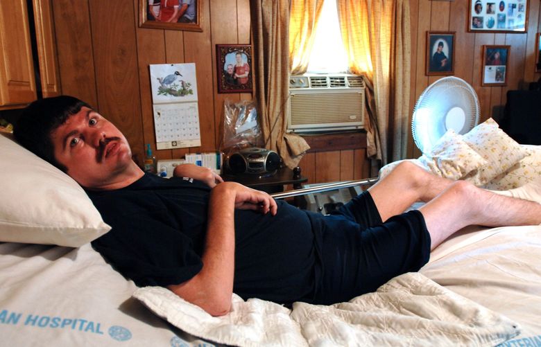 (NYT19) BIG FLAT, Ark. — July 3, 2006 — COMA-RECOVER — Terry Wallis, 42, at home in Big Flat, Ark., on July 3, 2006. For 19 years — until June 11, 2003 — Wallis lay mute and virtually unresponsive in a state of minimal consciousness, the result of a head injury suffered in a traffic accident. (Ron Phillips/The New York Times)