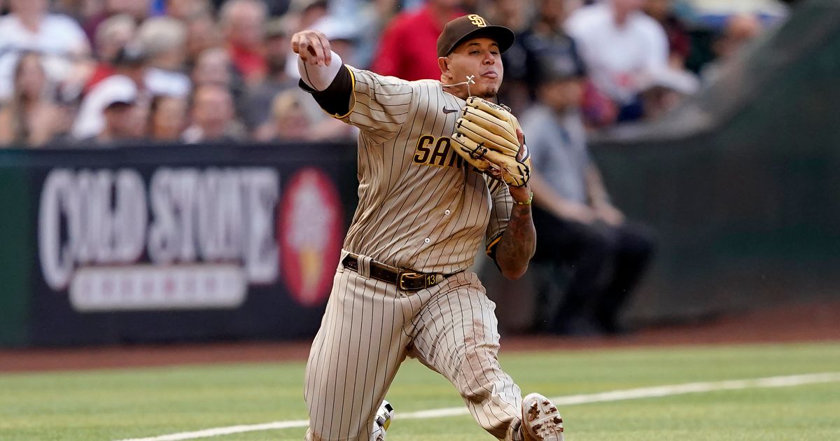 San Diego Padres' Luke Voit scores on a sacrifice fly by Austin