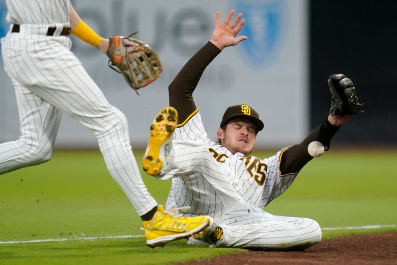 San Diego Padres' Luke Voit scores on a sacrifice fly by Austin