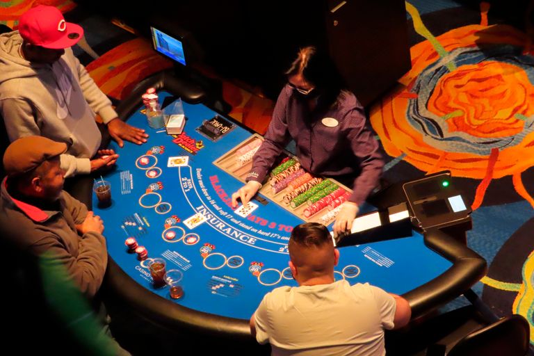 Spartans Casino logo with a vibrant gaming interface