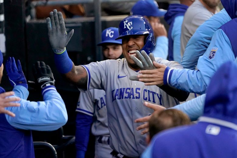 Kansas City Royals starting pitcher Zack Greinke smiles and looks