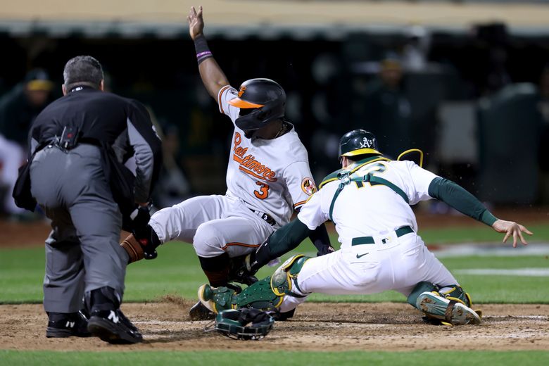 Cristian Pache of the Oakland Athletics catches a fly ball off the