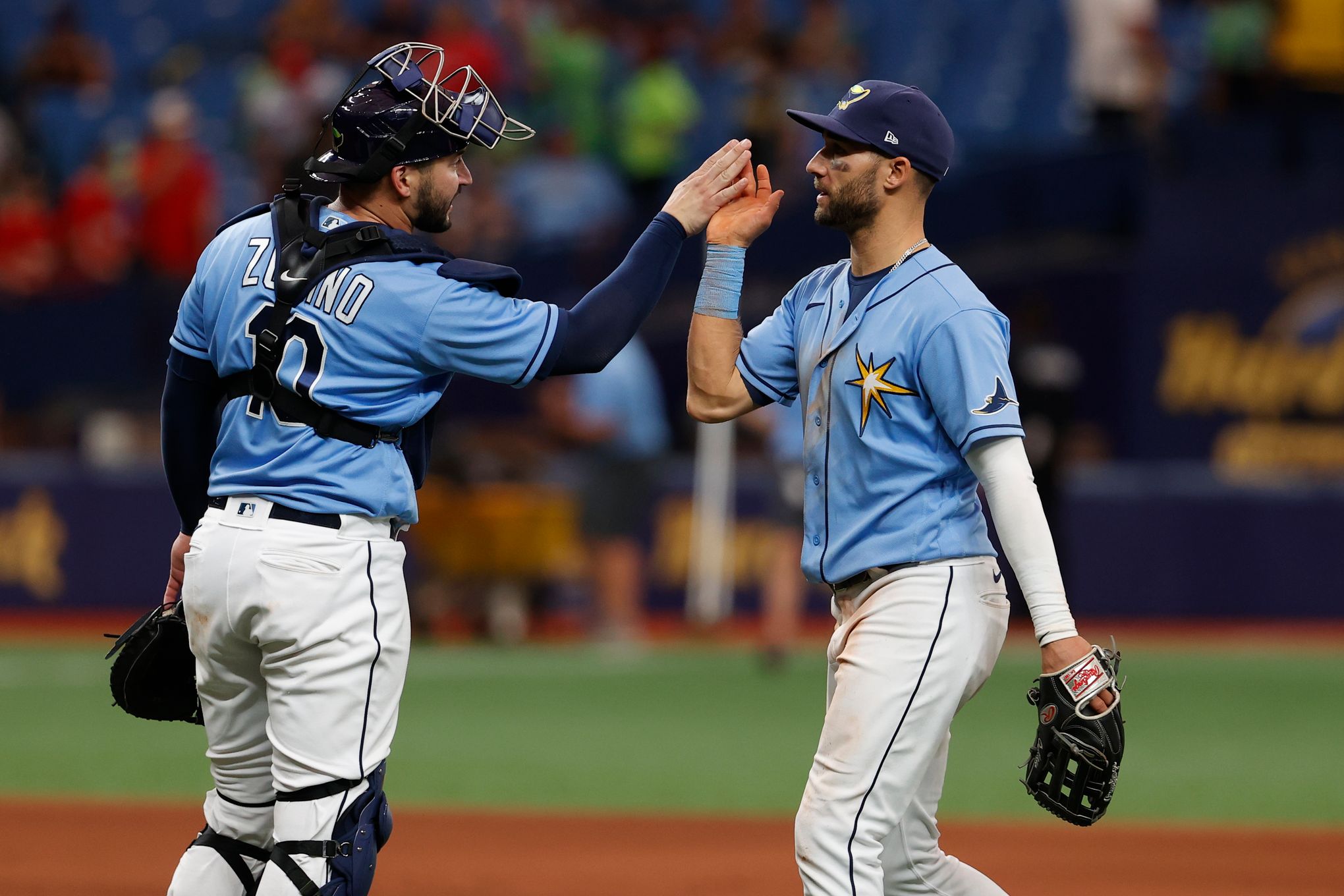 Tampa Bay Rays manager Kevin Cash, center, talks with catcher Mike