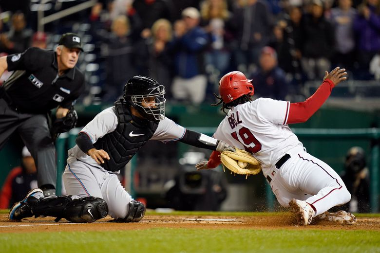 Joey Wendle of the Miami Marlins throws to first base for an out