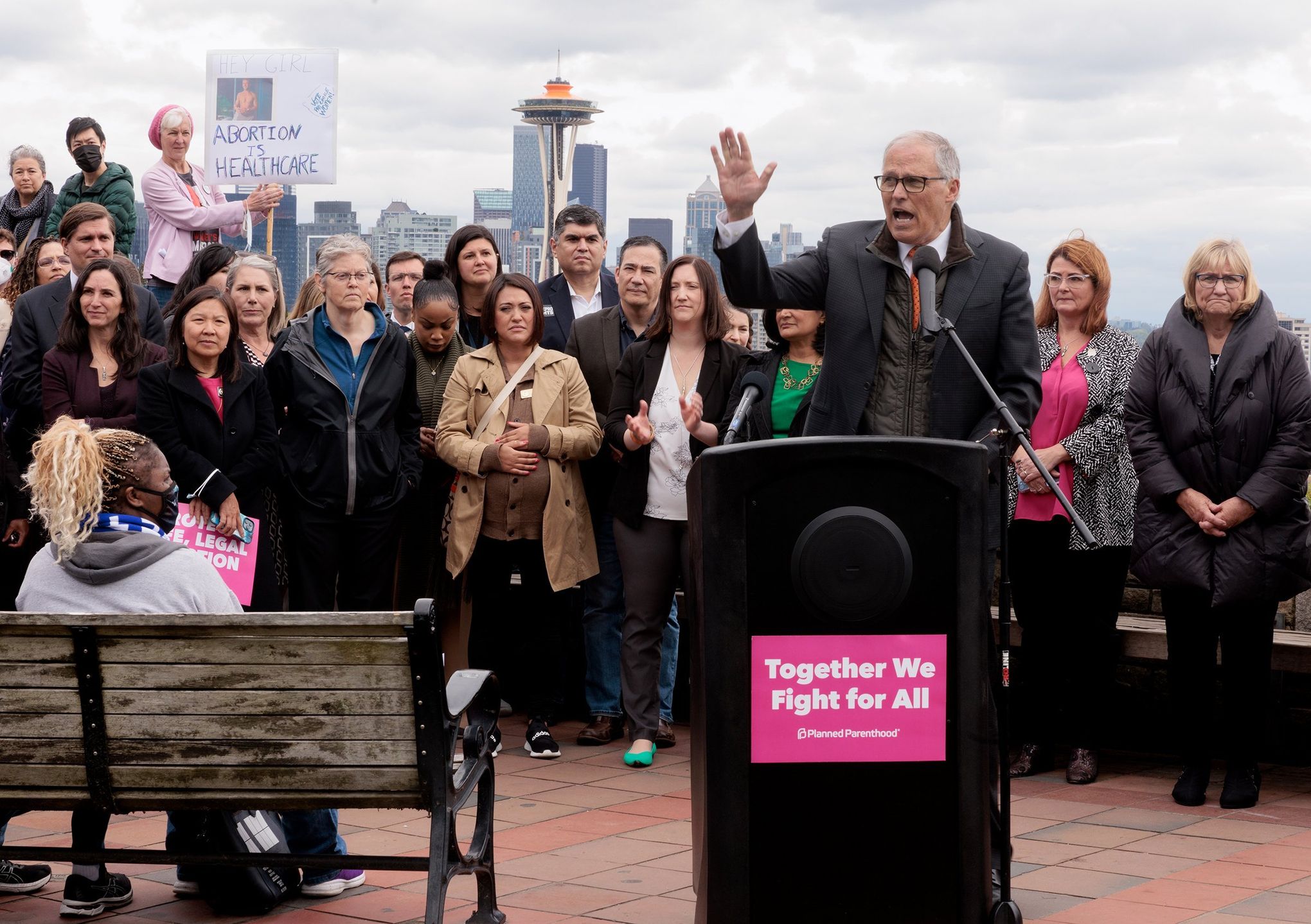 Gov. Jay Inslee speaks at podium at a news conference about the leaked Roe v. Wade Supreme Court draft opinion