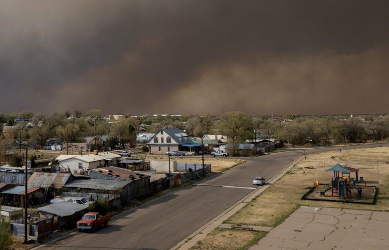 CORRECTS STATE TO NEW MEXICO INSTEAD OF NEVADA – The Calf Canyon Fire burns in the Gallinas Canyon near Las Vegas, N.M., Friday, April 29, 2022. (Eddie Moore/The Albuquerque Journal via AP) NMALJ703 NMALJ703