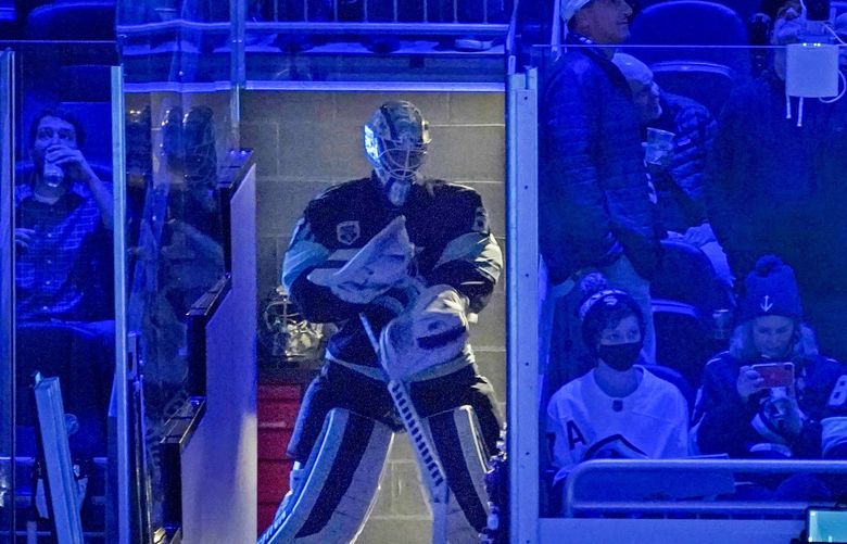 Seattle Kraken goaltender Chris Driedger waits to enter the ice during team introductions before an NHL hockey game against the Vegas Golden Knights, Wednesday, March 30, 2022, in Seattle. (AP Photo/Ted S. Warren) WATW105