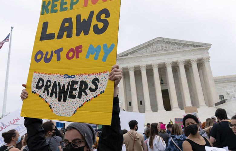 Demonstrators protest outside of the U.S. Supreme Court Tuesday, May 3, 2022 in Washington. A draft opinion suggests the U.S. Supreme Court could be poised to overturn the landmark 1973 Roe v. Wade case that legalized abortion nationwide, according to a Politico report released Monday. Whatever the outcome, the Politico report represents an extremely rare breach of the court’s secretive deliberation process, and on a case of surpassing importance. (AP Photo/Jose Luis Magana) DCJL123 DCJL123