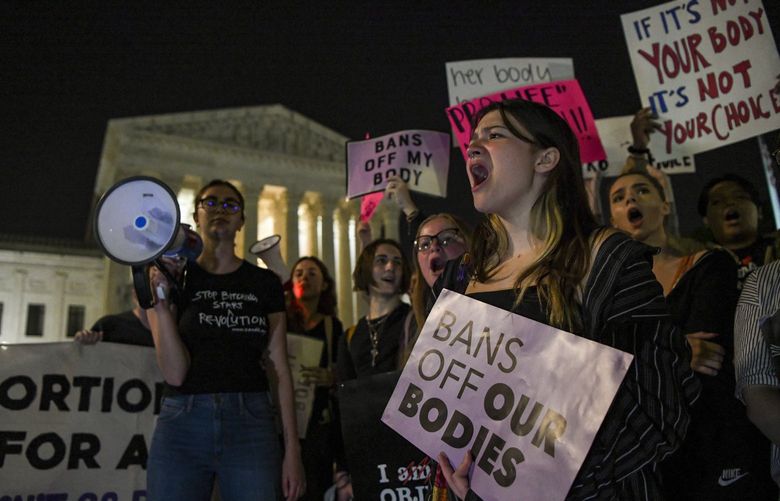 Pro-choice demonstrators outside the Supreme Court following a public leak of a draft opinion that the Supreme Court has potentially voted to overturn Roe V. Wade, in Washington, May 2, 2022. The decision, which is not expected to be finalized for another month or more and could change in its final form, would leave it to individual states to determine abortion’s legality. (Kenny Holston/The New York Times) XNYT14 XNYT14