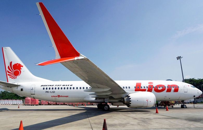 A grounded Lion Air Boeing Co. 737 Max 8 aircraft sits on the tarmac at terminal 1 of Soekarno-Hatta International Airport in Cenkareng, Indonesia, on Tuesday, March 15, 2019. Sundayâ€™s loss of an Ethiopian Airlines Boeing 737, in which 157 people died, bore similarities to the Oct. 29 crash of another Boeing 737 Max plane, operated by Indonesiaâ€™s Lion Air, stoking concern that a feature meant to make the upgraded Max safer than earlier planes has actually made it harder to fly. Photographer: Dimas Ardian/Bloomberg 775315808