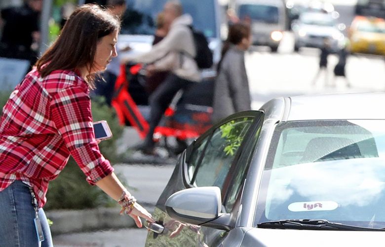 A Lyft passenger is picked up on 6th Avenue, near the Amazon Spheres. September 18, 2019. 211520