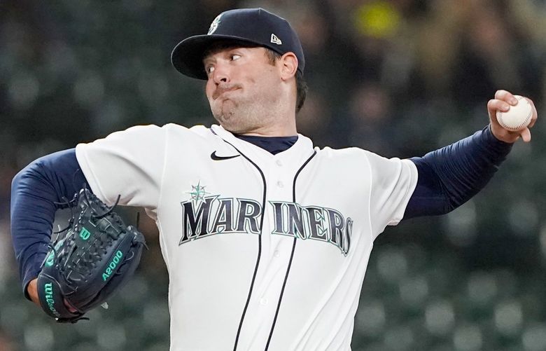 Seattle Mariners starting pitcher Robbie Ray throws to a Tampa Bay Rays batter during the first inning of a baseball game Thursday, May 5, 2022, in Seattle. (AP Photo/Ted S. Warren) WATW103