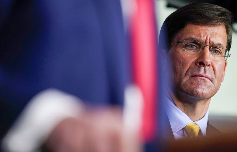 Defense Secretary Mark Esper listens as President Donald Trump speaks during press briefing with the Coronavirus Task Force, at the White House, Wednesday, March 18, 2020, in Washington. (AP Photo/Evan Vucci) DCEV433