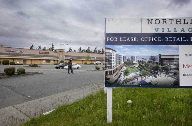 A rendering of Northline Village shows a bustling area with retail, homes and open space. The developer is still looking for partners and has yet to break ground. (Steve Ringman / The Seattle Times)