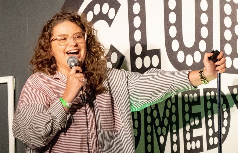 Comic Jessi Cialdella performs on stage at the Club Comedy Seattle open mic night on Wednesday, April 6, 2022.