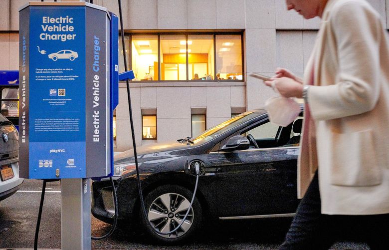 FILE — A public charging station for electric vehicles in New York, March 7, 2022. Prices at the pump have apparently given some Americans second thoughts about electric vehicles, but two practical problems remain: not enough cars and relatively few charging stations. (Gabby Jones/The New York Times) XNYT119