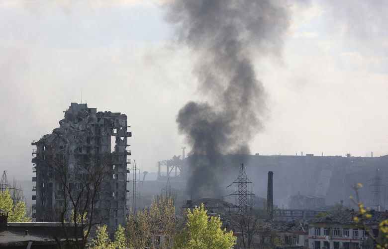 FILE – Smoke rises from the Azovstal steel mill in Mariupol, in territory under the government of the Donetsk People’s Republic, eastern Ukraine, May 4, 2022. (AP Photo/Alexei Alexandrov, File) NYAG501 NYAG501