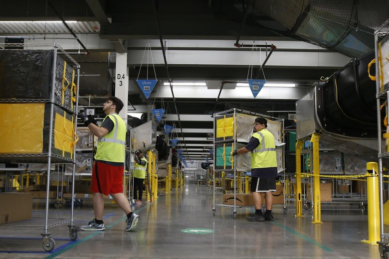 After struggling to hire enough workers in the first years of the COVID-19 pandemic, Amazon now finds itself with too many workers. (Ross D. Franklin / AP)