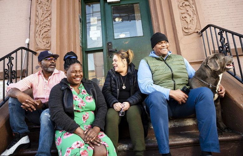 From left to right, Courtland Hankins III, Claudia Waterton, Lizzette Concepcion and Kevin Stone, outside their apartment building in the Port Morris neighborhood of the Bronx on April 29, 2022. The tenants fought their landlord, who planned to raise their rents, and are now poised to own their apartments. (Karsten Moran/The New York Times) XNYT138