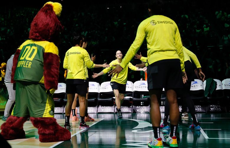 Climate Pledge Arena – Seattle Storm vs. Minnesota Lynx – 050622
Seattle Storm guard Sue Bird gets high-fives from teammates as she is introduced to the crowd before the start of a game Friday, May 6, 2022, in Seattle, Wash. 220302