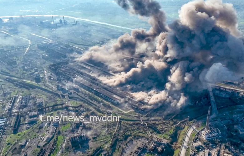 In this handout photo taken from video released on Wednesday, May 4, 2022 by Donetsk People’s Republic Interior Ministry Press Service, Smoke rises from the Metallurgical Combine Azovstal in Mariupol, in territory under the government of the Donetsk People’s Republic, eastern Ukraine. Heavy fighting is raging at the besieged steel plant in Mariupol as Russian forces attempt to finish off the city’s last-ditch defenders and complete the capture of the strategically vital port. (Donetsk People’s Republic Interior Ministry Press Service via AP) XAZ119 XAZ119