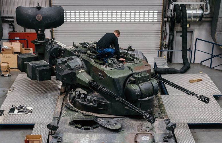 A mechanic works on a Gepard mobile antiaircraft system at the Krauss-Maffei Wegmann factory in Munich on April 27, 2022. The country’s chancellor has pledged about $100 billion to rebuild its army, but that increase in spending may not be enough to reverse years of neglect, experts say. (Felix Schmitt/The New York Times)