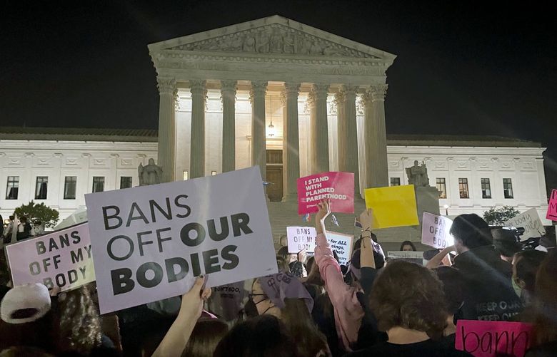 A crowd of people gather outside the Supreme Court, Monday night, May 2, 2022 in Washington. A draft opinion circulated among Supreme Court justices suggests that earlier this year a majority of them had thrown support behind overturning the 1973 case Roe v. Wade that legalized abortion nationwide, according to a report published Monday night in Politico. Itâ€™s unclear if the draft represents the courtâ€™s final word on the matter.  The Associated Press could not immediately confirm the authenticity of the draft Politico posted, which if verified marks a shocking revelation of the high courtâ€™s secretive deliberation process, particularly before a case is formally decided. (AP Photo/Anna Johnson) WX151 WX151