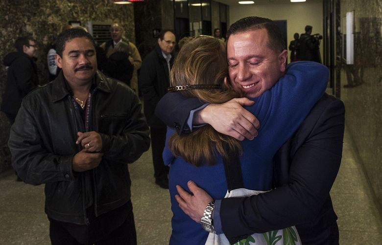 FILE — Johnny Hincapie, right, who spent 25 years in prison, after a court dropped his case in New York, Jan. 25, 2017. Hincapie said he was beaten and coerced into making a false confession by a detective who convinced him that admitting a minor role in the crime would allow him to go home and receive lenient punishment. (Christian Hansen/The New York Times) XNYT31 XNYT31