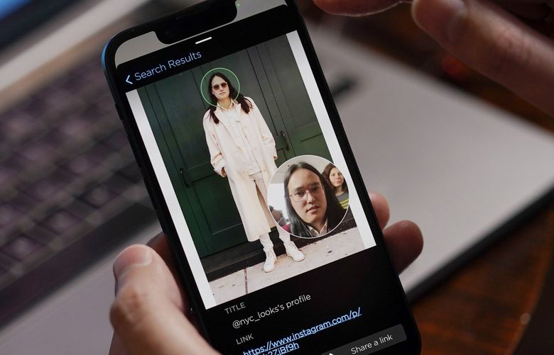 FILE – Hoan Ton-That, CEO of Clearview AI, demonstrates the company’s facial recognition software using a photo of himself in New York on Tuesday, Feb. 22, 2022. In a Monday, May 9, 2022 legal filing, the company has agreed to restrict the use of its massive collection of face images to settle allegations that it collected people’s photos without their consent. (AP Photo/Seth Wenig, File) NY638 NY638