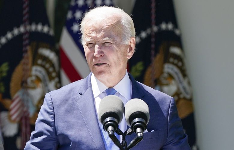 Vice President Kamala Harris, right, listens as President Joe Biden speaks at an event on lowering the cost of high-speed internet in the Rose Garden of the White House, Monday, May 9, 2022, in Washington. (AP Photo/Manuel Balce Ceneta) DCMC410 DCMC410