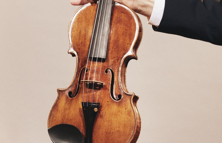 Jason Price, director of Tarisio auction company, holds the “da Vinci” Stradivarius violin in Berlin, Germany, April 30, 2022. Crafted in 1714 and played in “The Wizard of Oz” and other classic films, Toscha Seidel’s Stradivarius could sell for almost $20 million at an online auction running from May 18 through June 9, 2022. (Andrew White/The New York Times) XNYT47 XNYT47