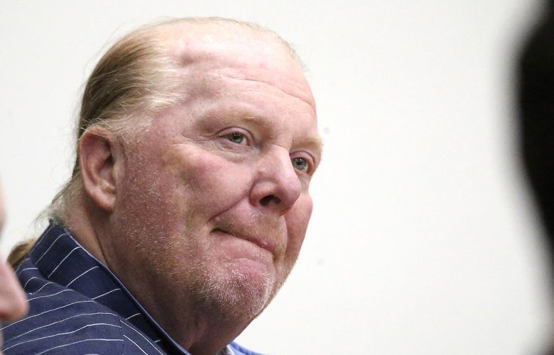 Celebrity chef Mario Batali listens during testimony at Boston Municipal Court on the second day of his sexual misconduct trial on Tuesday, May 10, 2022 in Boston. Batali pleaded not-guilty to a charge of indecent assault and battery in 2019, stemming from accusations that he forcibly kissed and groped a woman after taking a selfie with her at a Boston restaurant in 2017.  (Stuart Cahill/The Boston Herald via AP, Pool) MABOH104 MABOH104