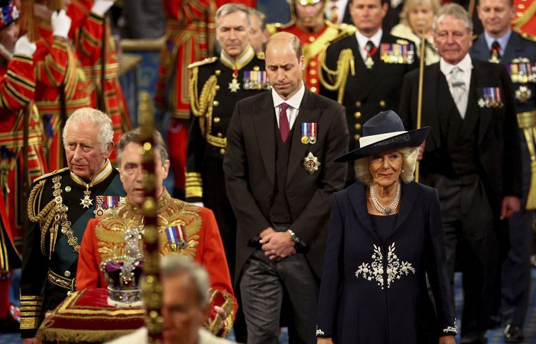 Britain’s Prince Charles, Camilla, Duchess of Cornwall and Britain’s Prince William proceed behind the Imperial State Crown through the Royal Gallery for the State Opening of Parliament at the Palace of Westminster in London, Tuesday, May 10, 2022. Britainâ€™s Parliament opens a new year-long session on Tuesday with a mix of royal pomp and raw politics, as Prime Minister Boris Johnson tries to re-energize his scandal-tarnished administration and revive the economy amid a worsening cost-of-living crisis. (Hannah McKay/Pool via AP) LGK119 LGK119