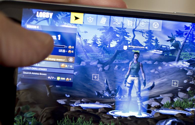 Fortnite: Battle Royale video game is displayed  on an Apple iPhone in in 2018. (Andrew Harrer/Bloomberg)