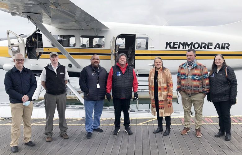 From left to right, Kenmore Air President Todd Banks, Kenmore Air COO John Gowey, Puyallup Tribal Councilman Fred Dillon, Puyallup Tribal Council Chairman Bill Sterud, Puyallup Tribal Council Vice Chairwoman Sylvia Miller, Puyallup Tribal Councilman James Rideout, Puyallup Tribal Councilwoman Annette Bryan. Members of the Puyallup Tribal Council took a flight in a Kenmore Air seaplane with Kenmore Air’s CEO and chief pilot. The plane took off from Thea Foss Waterway and flew over the Puyallup Tribe’s ancestral homelands.