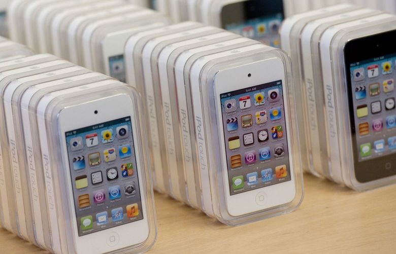 Boxes of the Apple Inc. iPod Touch are displayed for sale at the express check out counter of a store in San Francisco, California, U.S., on Friday, Nov. 25, 2011. Black Friday, traditionally the biggest U.S. shopping day of the year, got off to its earliest start ever as retailers tried to woo shoppers with discounts and early store openings. Photographer: David Paul Morris/Bloomberg