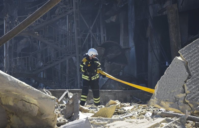 An Ukrainian firefighter works near a destroyed building on the outskirts of Odesa, Ukraine, Tuesday, May 10, 2022. The Ukrainian military said Russian forces fired seven missiles a day earlier from the air at the crucial Black Sea port of Odesa, hitting a shopping center and a warehouse.  (AP Photo/Max Pshybyshevsky) MBP104 MBP104