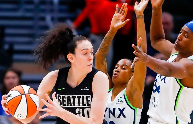 Climate Pledge Arena – Seattle Storm vs. Minnesota Lynx – 050622
Seattle Storm forward Breanna Stewart draws a double team of Minnesota Lynx guard Yvonne Turner, center, and center Sylvia Fowles during the fourth quarter Friday, May 6, 2022, in Seattle, Wash. 220302 220302