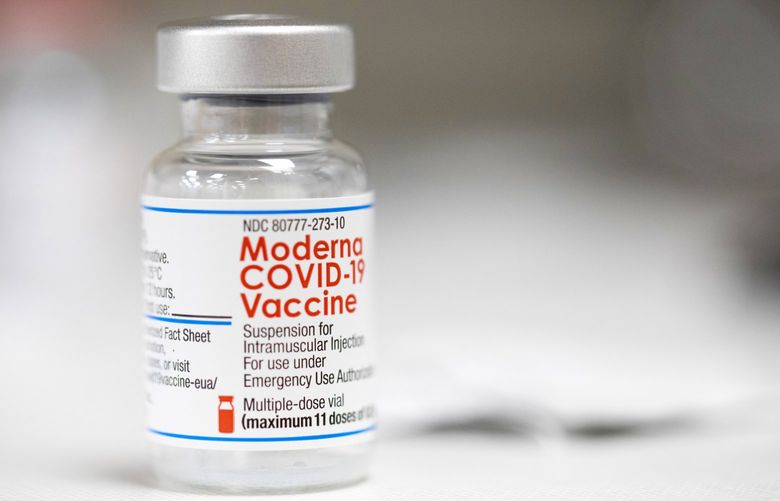 A vial of the Moderna COVID-19 vaccine is displayed on a counter at a pharmacy in Portland, Ore., Monday, Dec. 27, 2021. U.S. regulators have granted full approval to Moderna’s COVID-19 vaccine after reviewing additional data on its safety and effectiveness. The decision Monday, Jan. 31, 2022 by the Food and Drug Administration comes after many tens of millions of Americans have already received the shot under its original emergency authorization. Full approval means FDA has completed the same rigorous, time-consuming review for Moderna’s shot as dozens of other long-established vaccines. (AP Photo/Jenny Kane) NYPS203