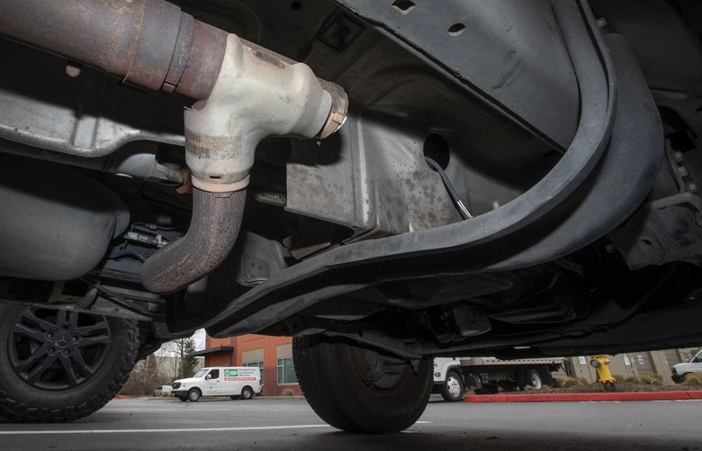 This Pacific Modular truck’s catalytic converter was stolen, at center, after being cut from the exhaust system, seen Wednesday, Feb. 2, 2022 in Renton.  219436
