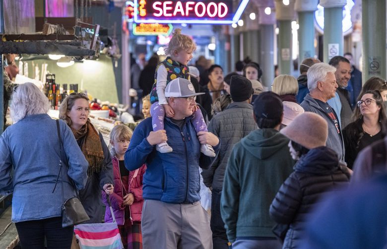 Tuesday, May 10, 2022.   People have given up on wearing masks at Pike Place Market in Seattle as we now see a new rise in Covid cases yet most people have moved on.   220360
