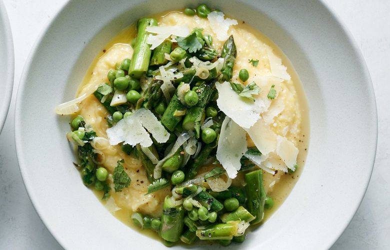 Polenta with asparagus, peas and mint, in New York, March 29, 2022. A versatile pot of polenta can accommodate pretty much anything you want to serve it with. Food styled by Simon Andrews. (David Malosh/The New York Times) XNYT55 XNYT55
