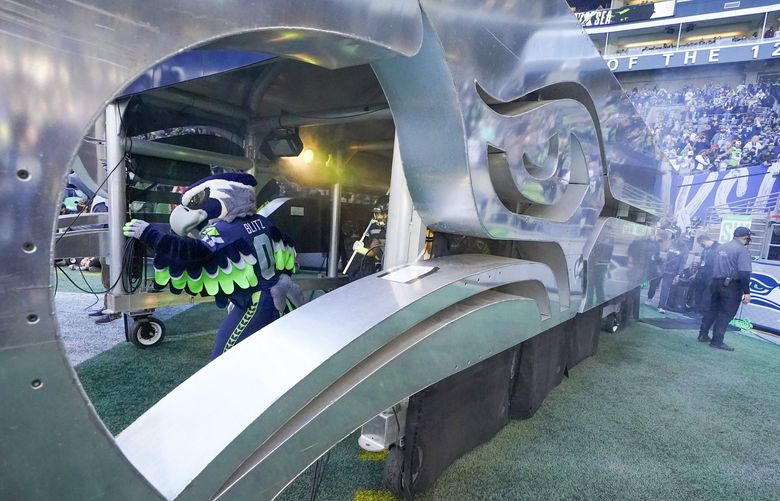 Blitz, the Seattle Seahawks mascot, runs out of the tunnel before an NFL football game against the Jacksonville Jaguars, Sunday, Oct. 31, 2021, in Seattle. (AP Photo/Ted S. Warren) OTK