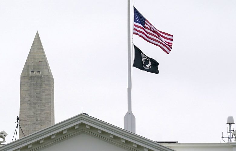 The American flag flies at half-staff at the White House in Washington, Thursday, May 12, 2022, as the Biden administration commemorates 1 million American lives lost due to COVID-19. (AP Photo/Susan Walsh) DCSW102