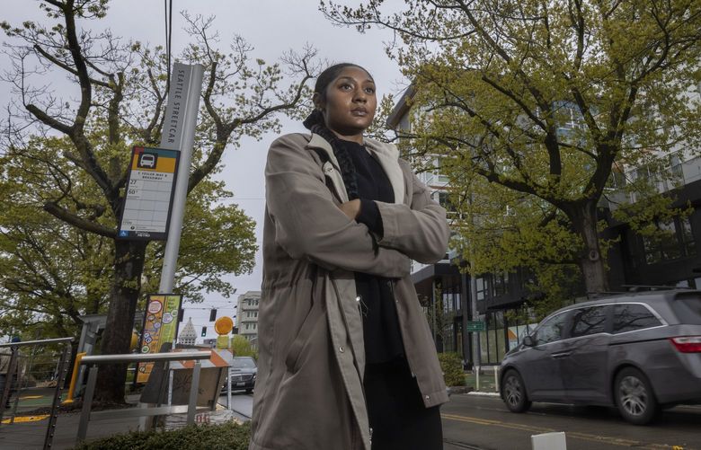 NiRae Petty, a young community organizer with the Urban League, lives by Yesler Terrace and Is advocating for residents in the neighborhood as Seattle prepares to reshape its City Council district this year for the first time.
Yesler Terrace is currently split between two City Council districts. Petty is standing near the intersection of Yesler Way and 10th Ave. S. Monday, May 2, 2022. Homes in the complex at right are in District 3, the Yesler Community Center at left is in District 2. Petty is pushing the city to listen to community concerns. 220280