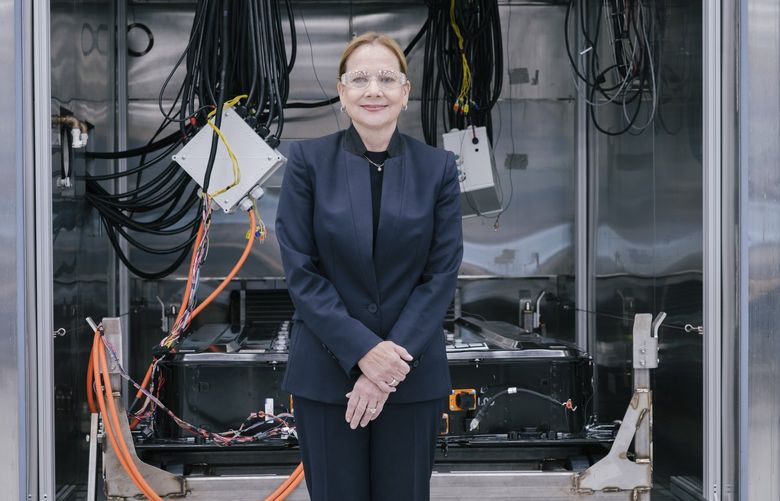 Mary Barra, the chief executive of General Motors, with one of the automaker’s Ultium battery units at the Estes Engineering Lab in Warren, Mich., April 5, 2022. In the battle for the emerging market for electric vehicles, GM is banking on creating a superior economy of scale from a modular battery pack design that can be used in any of its vehicles. “That’s the long game we are playing,†Barra said. (Peter Hoffman/The New York Times)